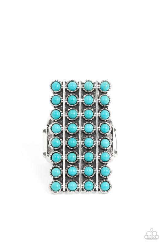 Paparazzi Accessories Pack Your SADDLEBAGS - Blue Bordered in antiqued silver studs, rows of dainty turquoise stones boldly stack up the finger across the front of an oversized rectangular silver frame for an earthy vibe atop the finger. Features a stretc