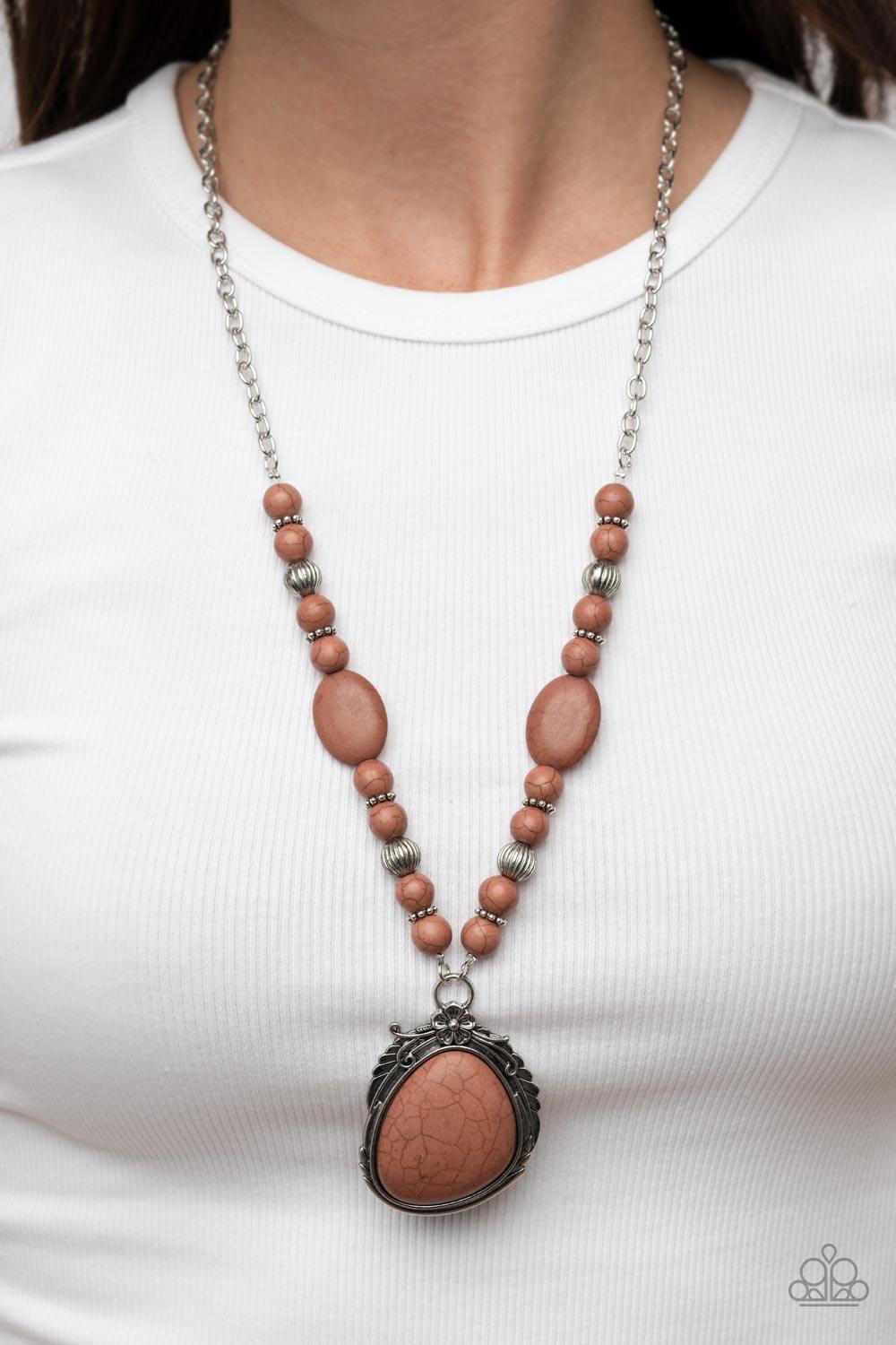 Paparazzi Accessories Southwest Paradise - Brown A lengthened silver chain flows into a succession of polished brown stone beads and silver accents. The flowy display gives way to an opulent brown stone that is pressed into an ornate silver frame. Adorned