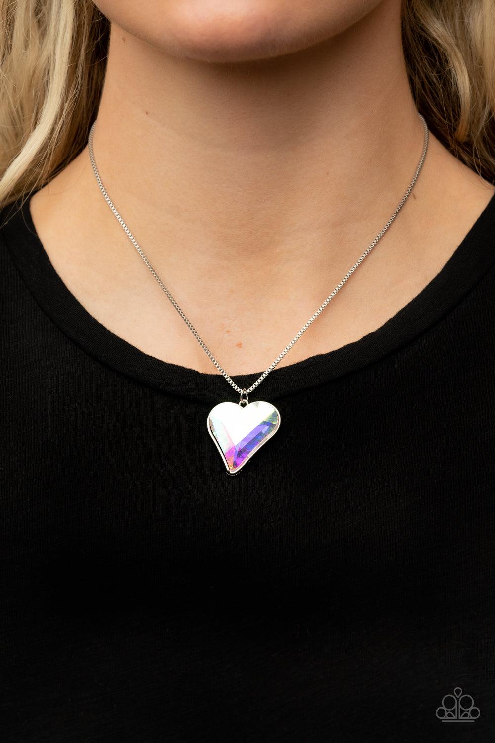Paparazzi Accessories Lockdown My Heart - Multi An iridescent heart-shaped gem is pressed into a simple silver frame at the end of a silver box chain creating an adorable sentiment below the collar. Features an adjustable clasp closure. Sold as one indivi