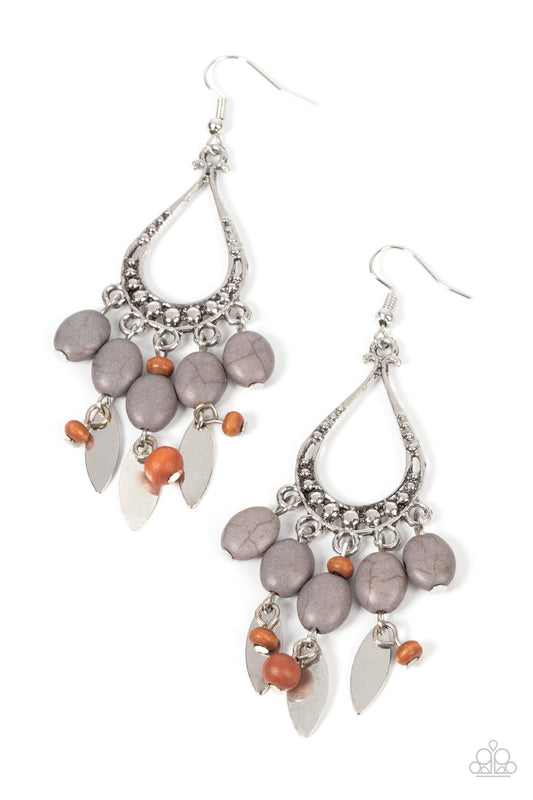 Paparazzi Accessories Adobe Air - Silver An earthy assortment of Ultimate Gray stones, wooden beads, and rustic silver frames cascade from the bottom of a studded silver teardrop, resulting in an artisan inspired fringe. Earring attaches to a standard fis