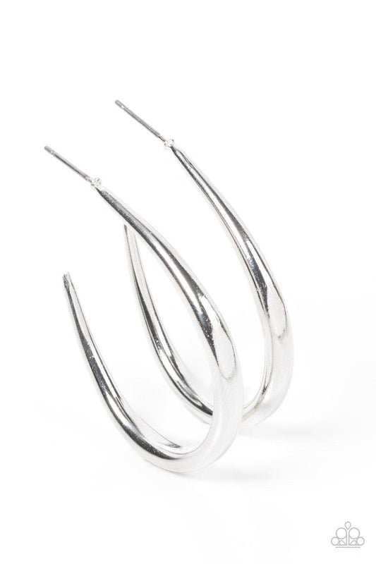 Paparazzi Accessories CURVE Your Appetite - Silver A shiny silver bar sharply curves into an asymmetrical hoop, adding a flash of metallic edge to any outfit. Earring attaches to a standard post fitting. Hoop measures approximately 1 1/4" in diameter. Sol