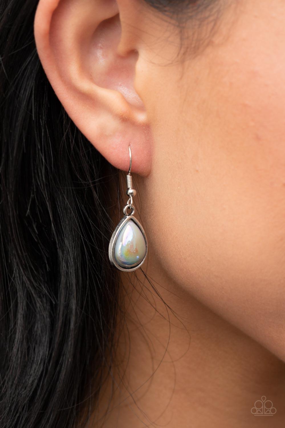 Paparazzi Accessories Magical Masquerade - Silver Brushed in an iridescent finish, a silvery teardrop bead is pressed into the center of an oversized silver teardrop frame that is bursting with vine-like filigree. Infused with matching teardrop beaded fra