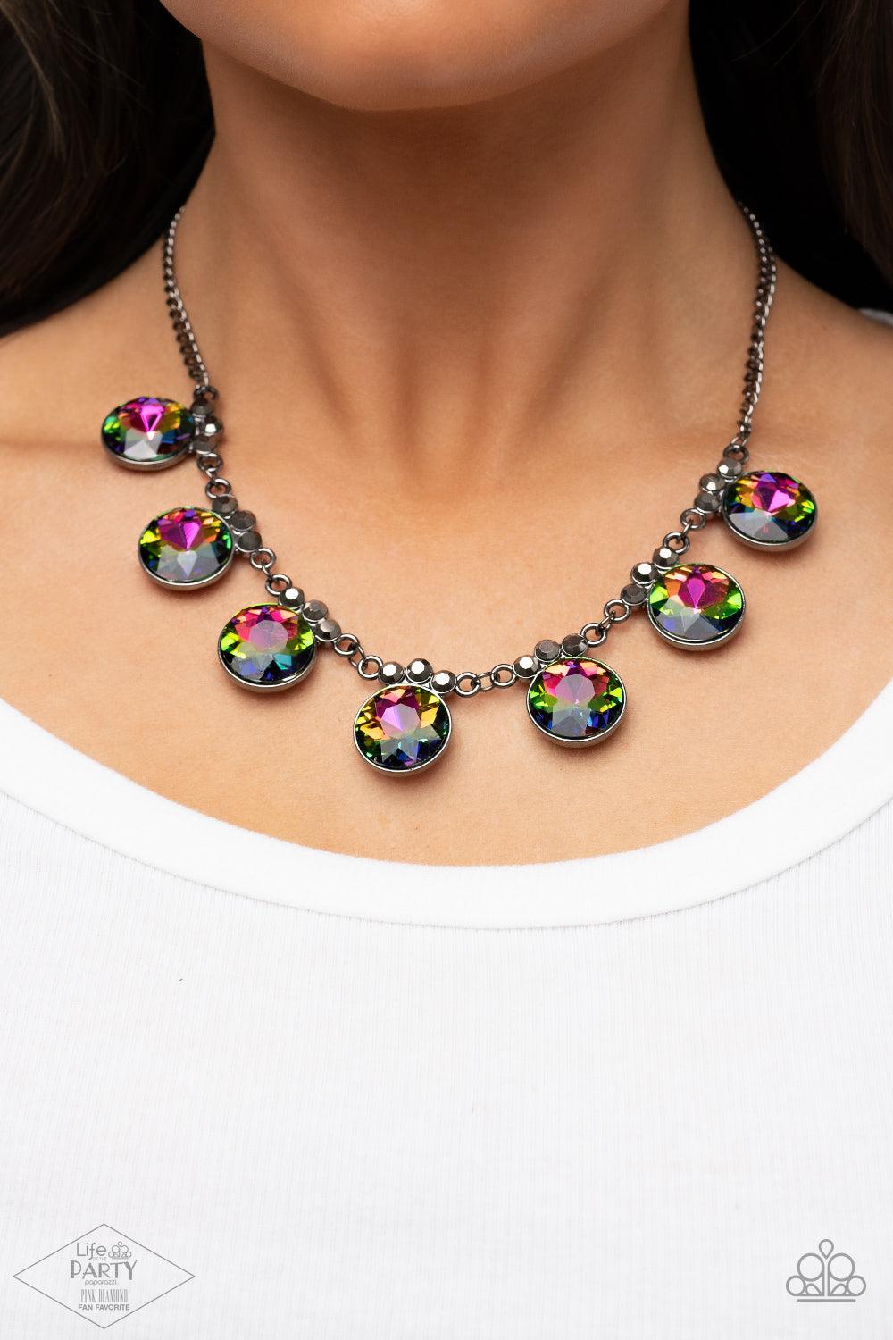 Paparazzi Accessories GLOW-Getter Glamour - Multi Crowned in a trio of dainty hematite rhinestones, an exaggerated display of oversized oil spill gems delicately link below the collar for a glamorous glow. Features an adjustable clasp closure. Sold as one