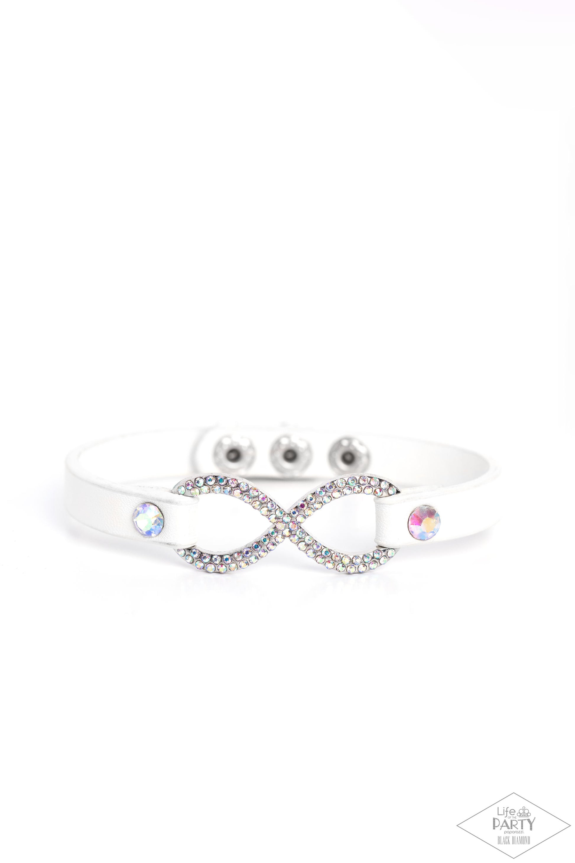Paparazzi Accessories Innocent Till Proven GLITZY! - Multi A skinny strip of white leather attaches to a silver infinity symbol encrusted in glittery iridescent rhinestones. Flanked by two dazzling solitaire iridescent rhinestones, the glitzy design creat
