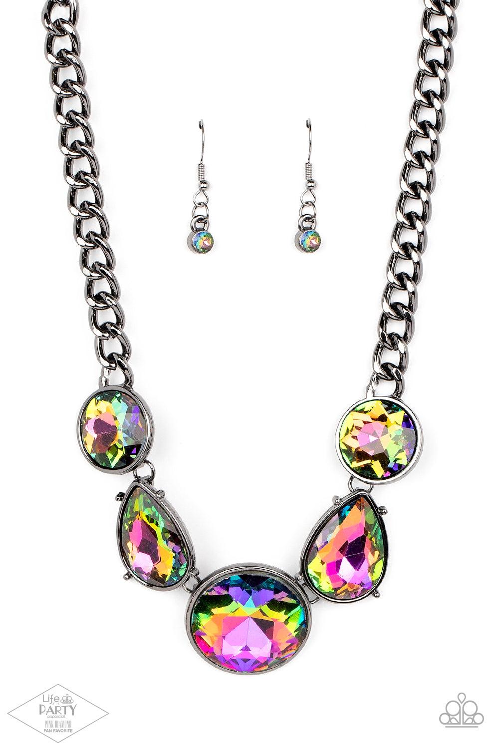 Paparazzi Accessories All The Worlds My Stage - Multi Infused with heavy gunmetal chain, an exaggerated display of round and teardrop-shaped oil spill rhinestones connects below the collar for a blinding look. Features an adjustable clasp closure. Sold as
