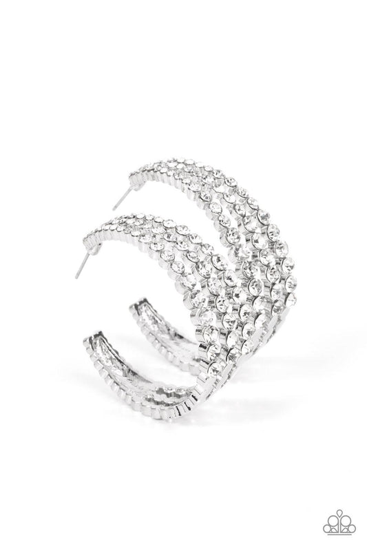 Paparazzi Accessories Cosmopolitan Cool - White Cascading layers of sparkling white rhinestones plunge into flattened silver plates creating a stunning eye-catching hoop earring. Earring attaches to a standard post fitting. Hoop measures approximately 2"