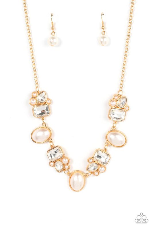 Paparazzi Accessories Sensational Showstopper - Gold Swoon-worthy emerald cut and teardrop rhinestones, accented with bubbly pearl beads, coalesce into stunning asymmetrical gold frames. A trio of elegant white oval pearl beads alternates with the asymmet