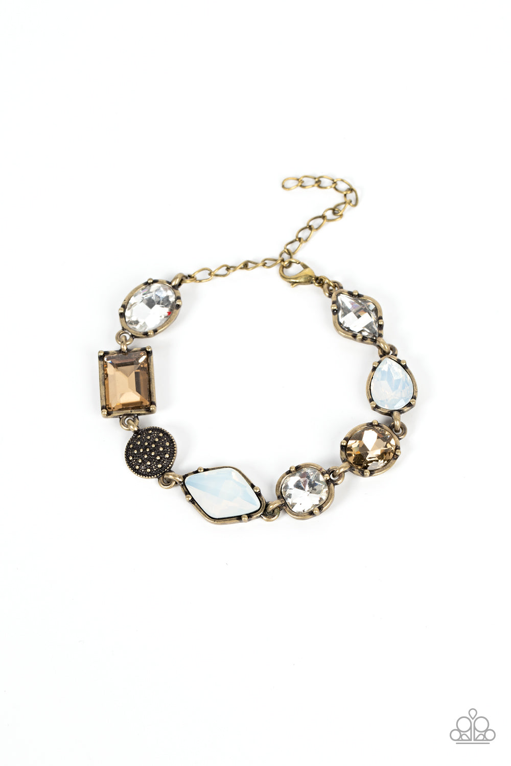 Paparazzi Accessories Jewelry Box Bauble - Brass Encased in pronged brass fittings, a mismatched collection of brassy, white, and opal rhinestones delicately links with a studded brass frame around the wrist for a sentimental sparkle. Features an adjustab