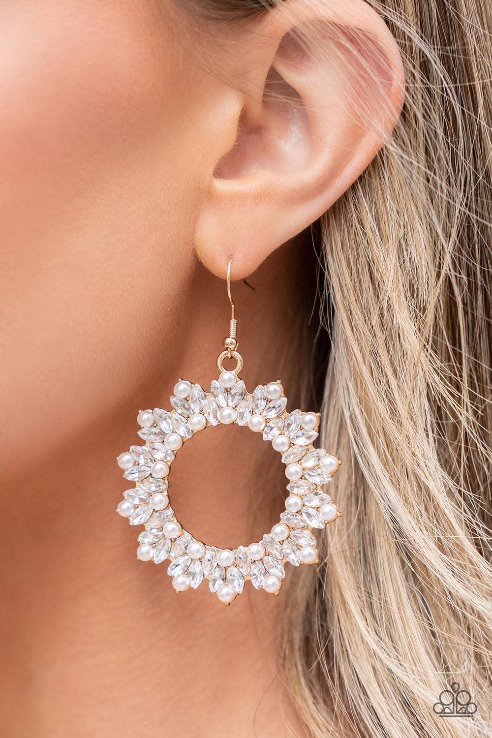 Paparazzi Accessories Combustible Couture - Gold A bubbly collection of dainty white pearls and marquise-cut rhinestones explodes across the front of a gold wreath, resulting in jaw-dropping dazzle. Earring attaches to a standard fishhook fitting. Sold as