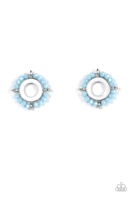 Paparazzi Accessories Nautical Notion - Blue Featuring dainty silver accents, a ring of blue crystal-like beads encircles a silver ring painted in a shiny white finish for a nautical inspired look. Earring attaches to a standard post fitting. Sold as one