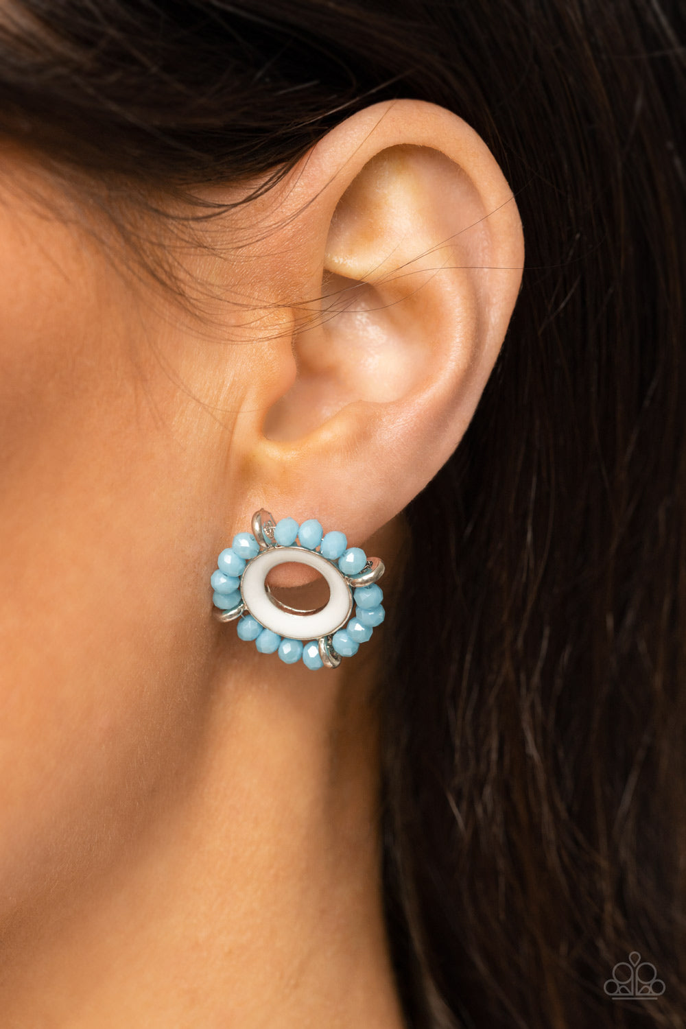 Paparazzi Accessories Nautical Notion - Blue Featuring dainty silver accents, a ring of blue crystal-like beads encircles a silver ring painted in a shiny white finish for a nautical inspired look. Earring attaches to a standard post fitting. Sold as one
