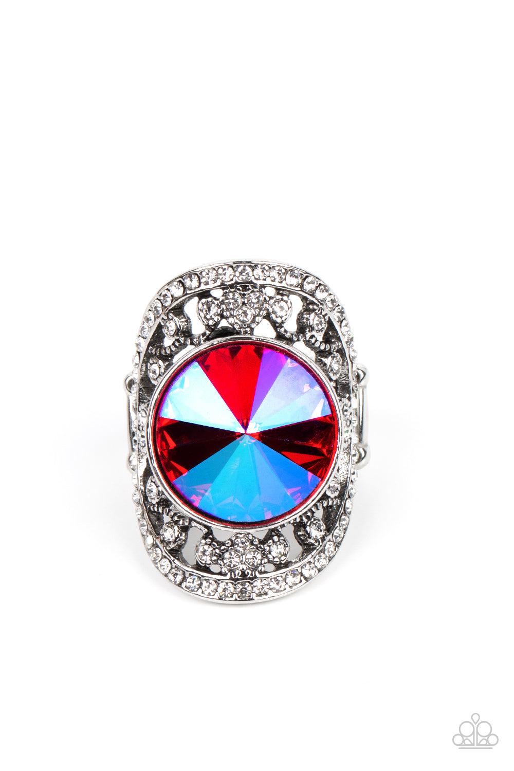 Paparazzi Accessories Galactic Garden - Pink A dramatically oversized, opalescent pink gem is pressed into the center of an oval silver frame dotted and bordered in glassy white rhinestones, resulting in a sparkly filigree-filled centerpiece atop the fing