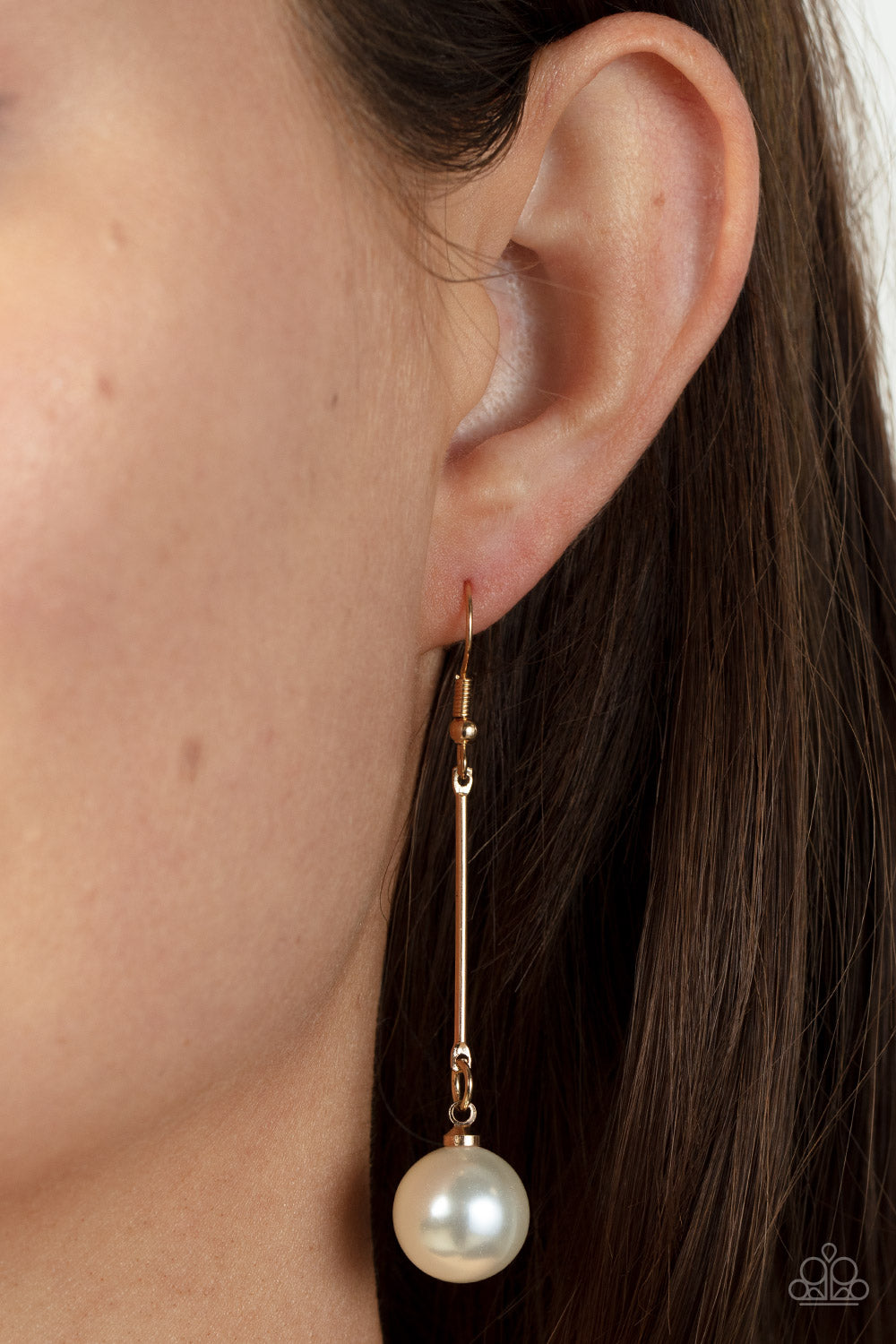 Paparazzi Accessories Pearl Redux - Gold An oversized white pearl delicately links to the bottom of a sleek gold rod, adding a timeless twist to the classic pearl palette. Earring attaches to a standard fishhook fitting. Sold as one pair of earrings. Jewe