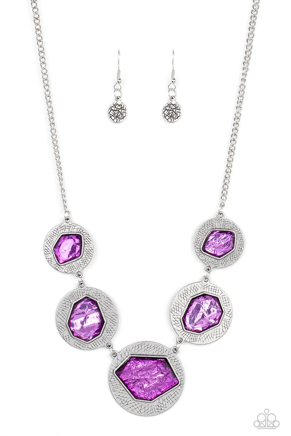 Paparazzi Accessories Raw Charisma - Purple Featuring a refracted shimmer, asymmetrical, glassy purple gems sparkle atop textured silver discs as they delicately link into an edgy statement piece below the collar. Features an adjustable clasp closure. Sol
