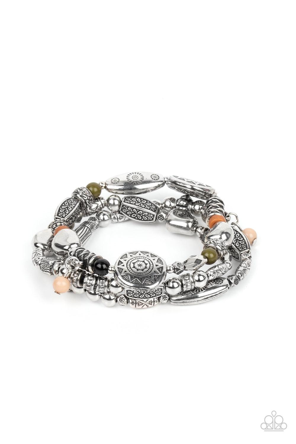 Paparazzi Accessories Western Quest - Multi Infused with hints of black, Olive Branch, Adobe, and Soybean accents, a mismatched collection of silver beads, textured silver accents, and floral and sunburst embossed beads are threaded along stretchy bands a