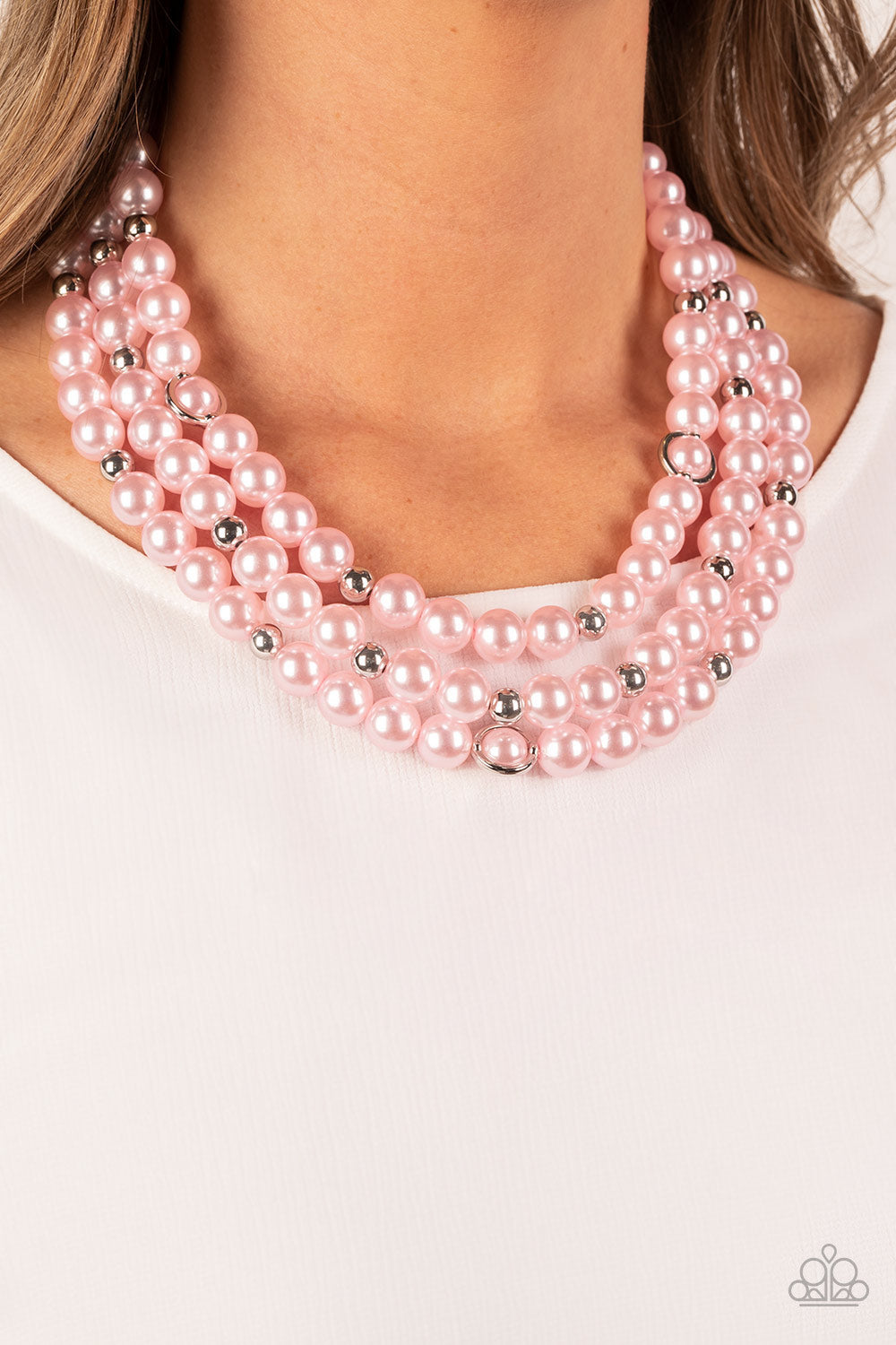 Paparazzi Accessories Needs No Introduction - Pink Infused with silver beads and silver rings, a bubbly collection of pink pearls are threaded along invisible wires that cascade into effervescent layers below the collar. Features an adjustable clasp closu