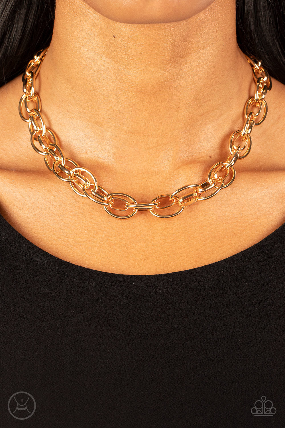 Paparazzi Accessories Tough Crowd - Gold An oversized gold chain interlocks with an oval linked chain, resulting in a rebellious fashion around the neck. Features an adjustable clasp closure. Sold as one individual choker necklace. Includes one pair of ma