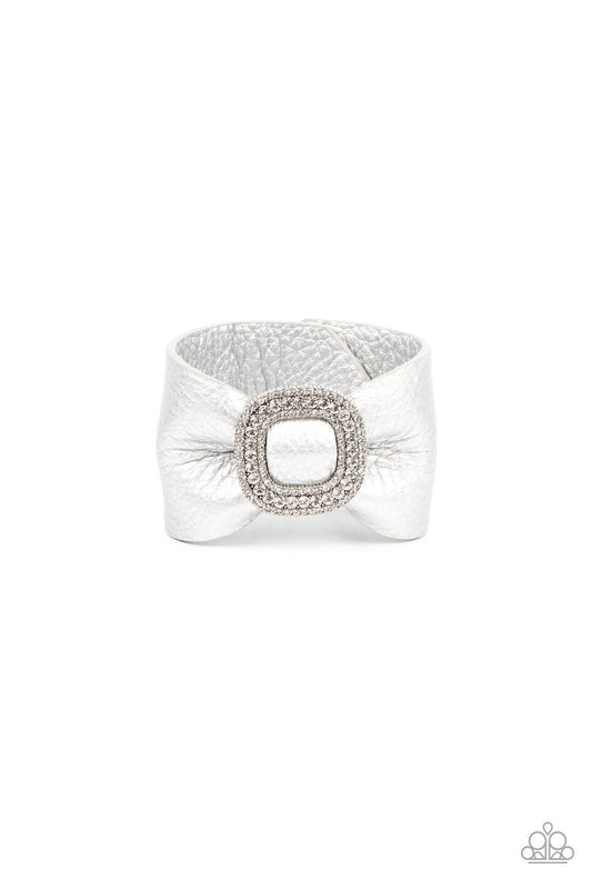 Paparazzi Accessories Lights, SELFIE, Action! - Silver Brushed in a shimmery silver finish, a thick pleather band delicately knots around the wrist. Stacked with brilliant white rhinestones, a dramatic silver buckle sparkles at the center of the wrist for