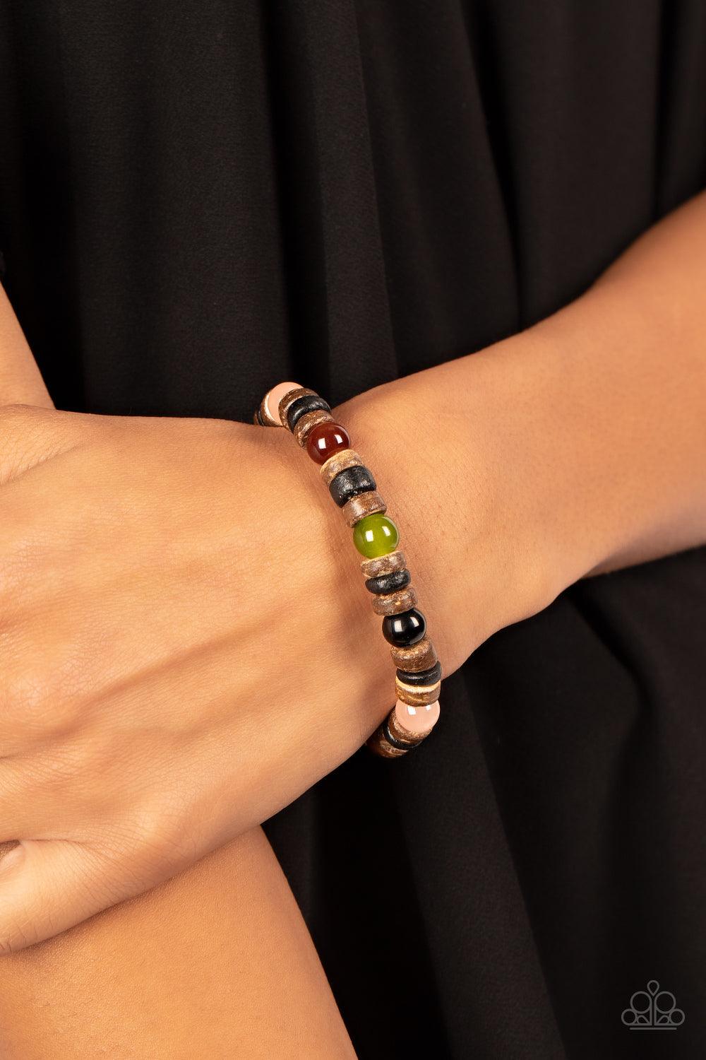 Paparazzi Accessories Durango Drifter - Multi Glassy multicolored stone beads join trios of black and brown wooden discs along stretchy bands around the wrist, resulting in an earthy pop of color. Sold as one individual bracelet. Bracelets