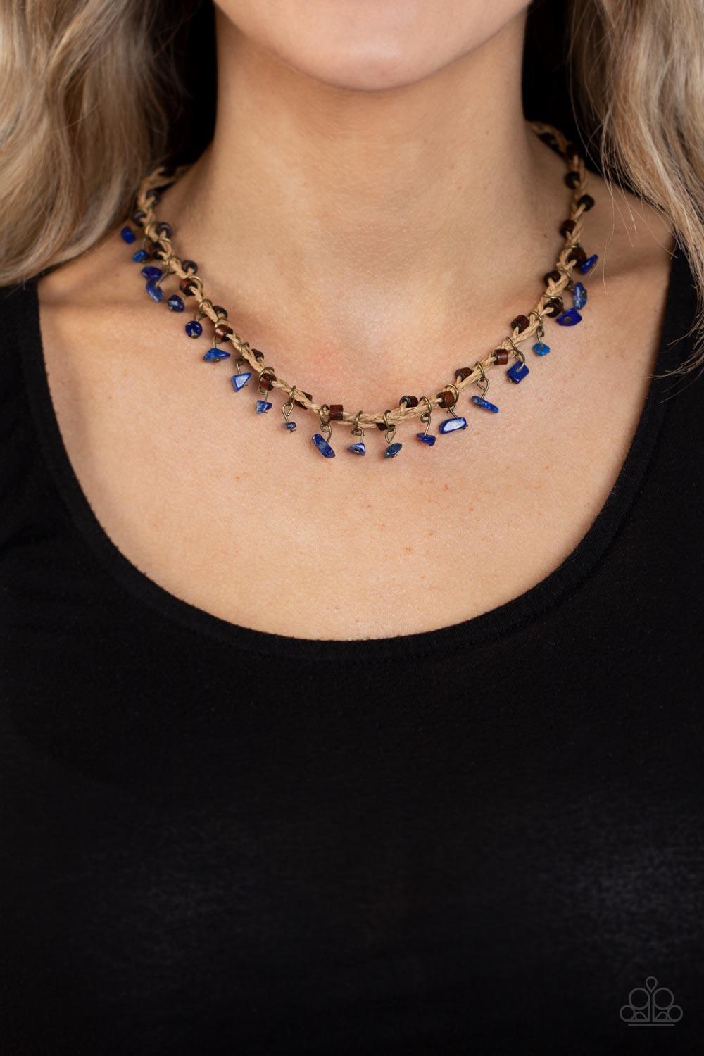 Paparazzi Accessories Canyon Voyage - Blue Infused with wooden accents, pieces of lapis lazuli swing from braided strands of crepe-like twine below the collar for a seasonal fringe. Features a button loop closure. Sold as one individual necklace. Necklace