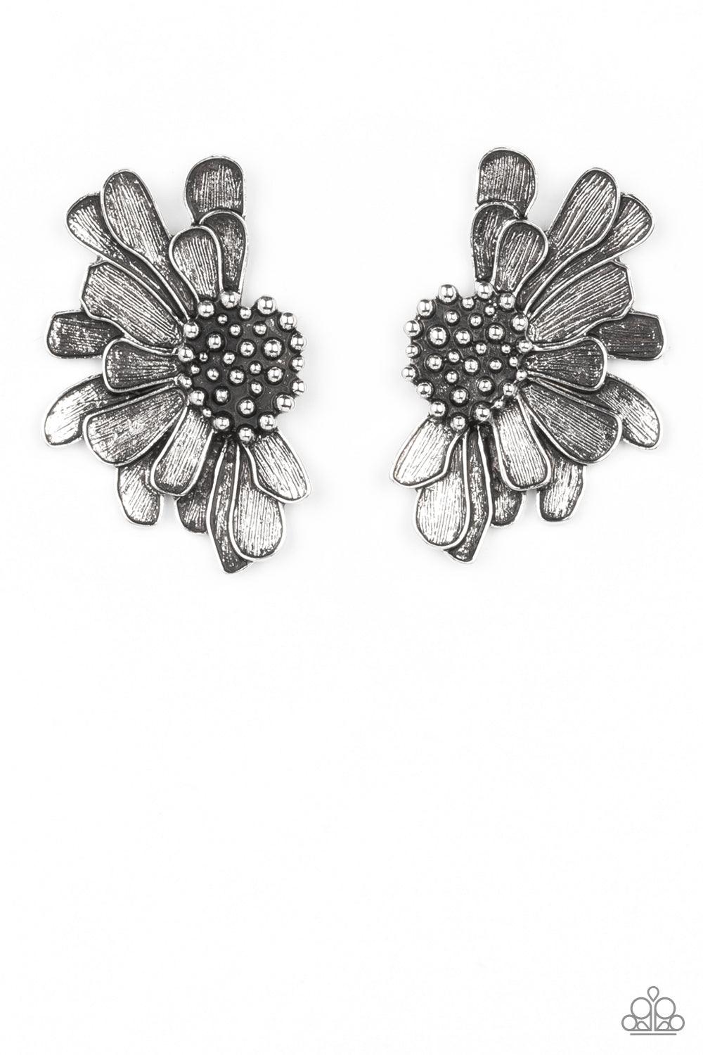 Paparazzi Accessories Farmstead Meadow - Silver Imperfect silver petals bloom from a studded center, layering into a rustic half blossom for a whimsical flair. Earring attaches to a standard post fitting. Sold as one pair of post earrings. Earrings