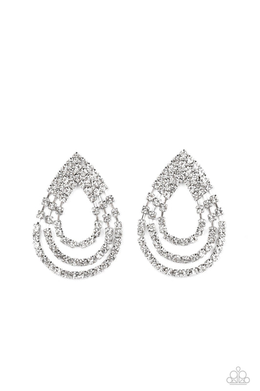 Paparazzi Accessories Take a POWER Stance - White Loops of glassy white rhinestones ripple out from the bottom of a stationary triangular fitting that is dotted in glittery white rhinestones, resulting in a timeless teardrop chandelier. Earring attaches t