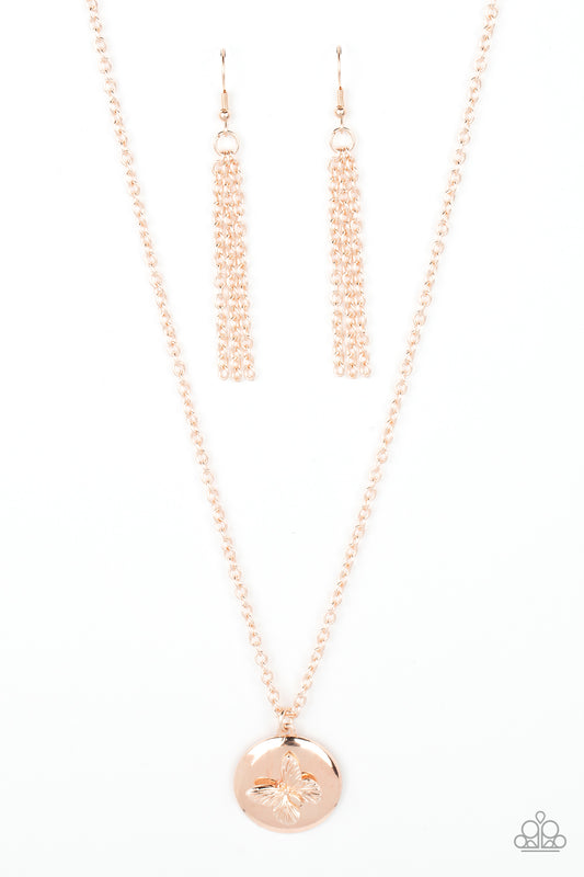 Paparazzi Accessories Monarch Meadow - Gold A dainty rose gold butterfly flutters atop a beveled rose gold disc, resulting in a whimsical pendant at the bottom of a classic rose gold chain. Features an adjustable clasp closure. Sold as one individual neck