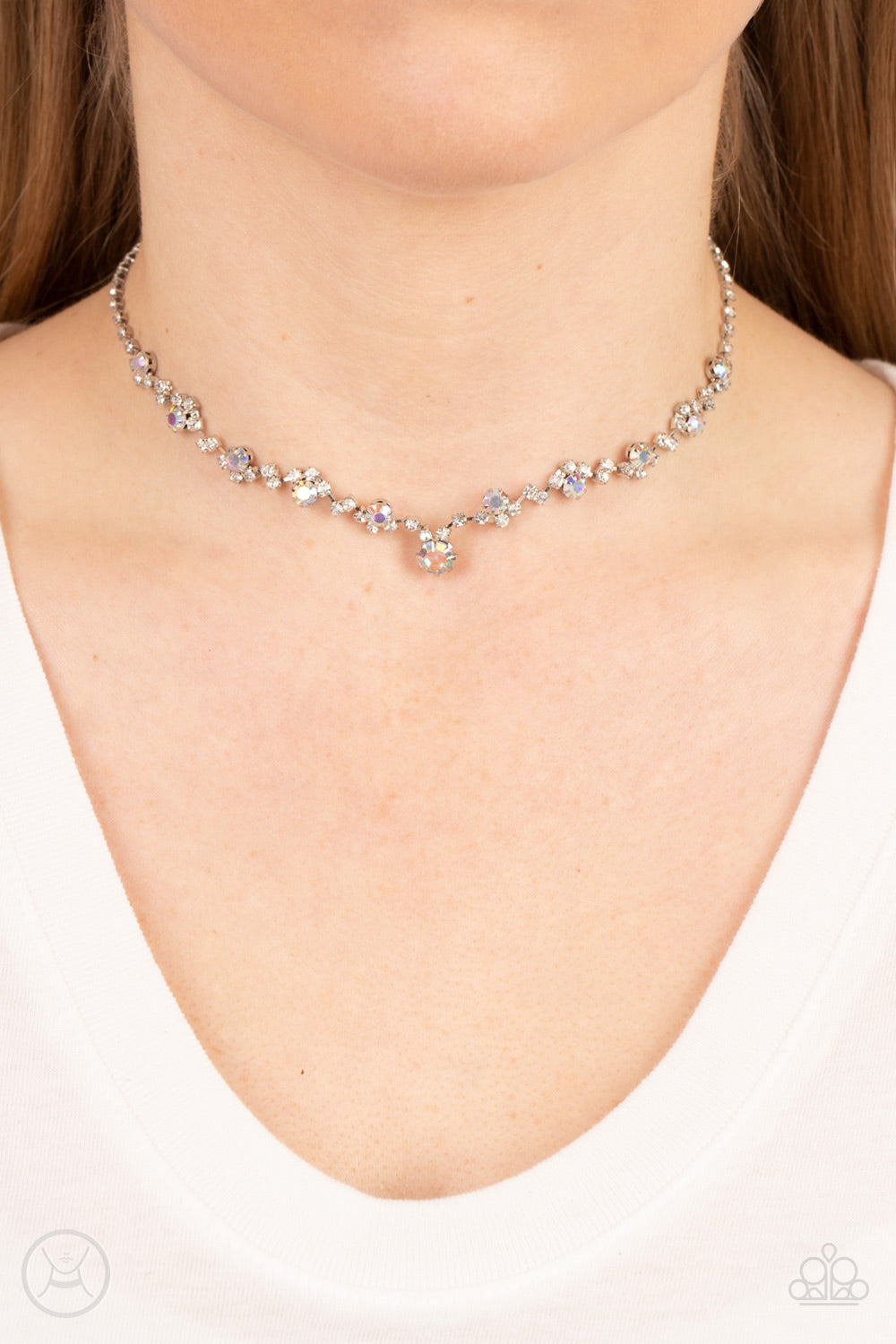 Paparazzi Accessories Regal Rebel - Multi Featuring pronged silver fittings, pairs and clusters of dainty white and iridescent rhinestones delicately connect to a strand of icy white rhinestones around the neck for a regal attitude. Features an adjustable