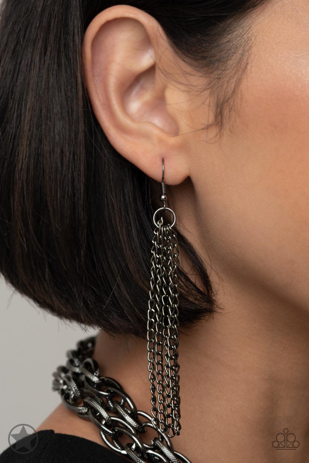 Paparazzi Accessories SCARFed for Attention - Gunmetal A single strand of spiraling, interlocking links with light-catching texture is anchored by two tassels of chain that add dramatic length to the piece. Undeniably the most versatile piece in Paparazzi