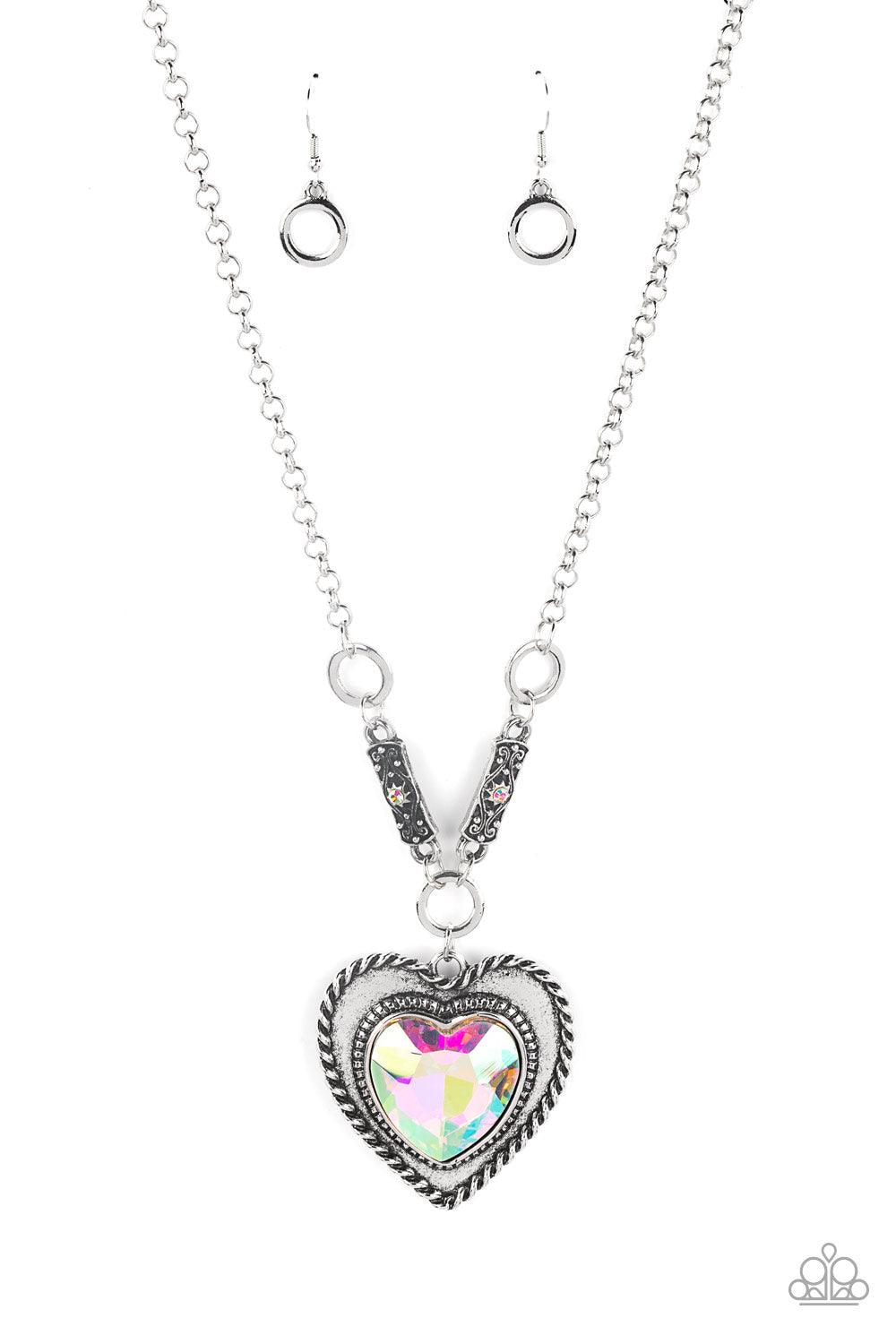 Paparazzi Accessories Heart Full of Fabulous - Multi Bordered in spun silver ribbons, an oversized iridescent heart gem is pressed into a silver heart frame below the collar. The flirtatious pendant attaches to silver rings and decorative silver frames do