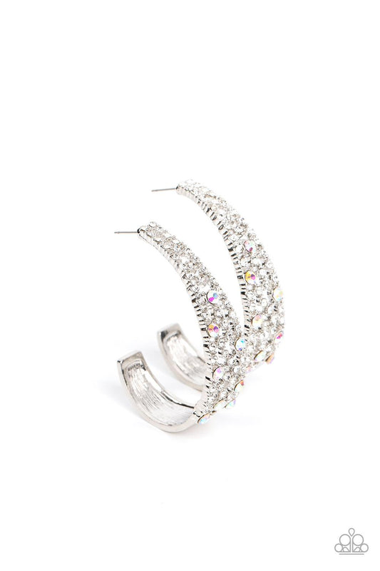 Paparazzi Accessories Cold as Ice - Multi Iridescent rhinestones dot a silvery backdrop of icy white rhinestones that delicately curves into a solid silver J-hoop, resulting in a jaw-dropping dazzle. Earring attaches to a standard post fitting. Hoop measu
