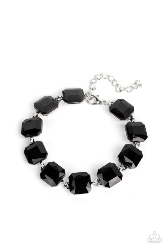 Paparazzi Accessories Mind-Blowing Bling - Black Featuring radiant cuts, glittery black rhinestones sit atop silver frames as they delicately link around the wrist for a mind-blowing brilliance. Features an adjustable clasp closure. Sold as one individual