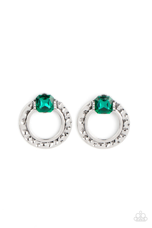 Paparazzi Accessories Smoldering Scintillation - Green Featuring a radiant cut, a green rhinestone sparkles between two dainty rows of glassy white rhinestones atop a hammered silver ring for a gritty yet glamorous finish. Earring attaches to a standard p