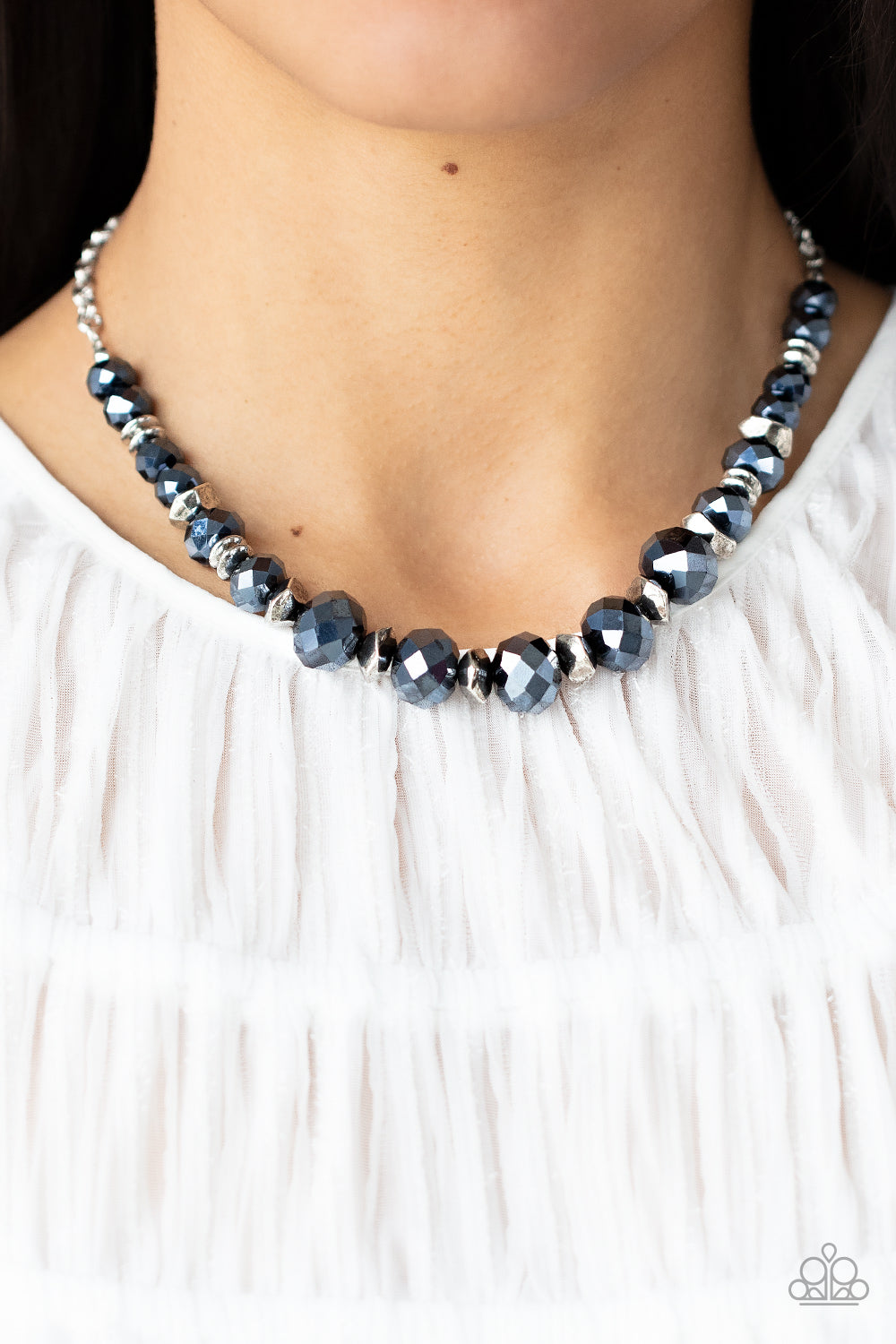 Paparazzi Accessories Cosmic Cadence - Blue Separated by silver discs and faceted silver accents, faceted blue crystal-like gems are threaded along an invisible wire below the collar for a stellar statement. Features an adjustable clasp closure. Sold as o