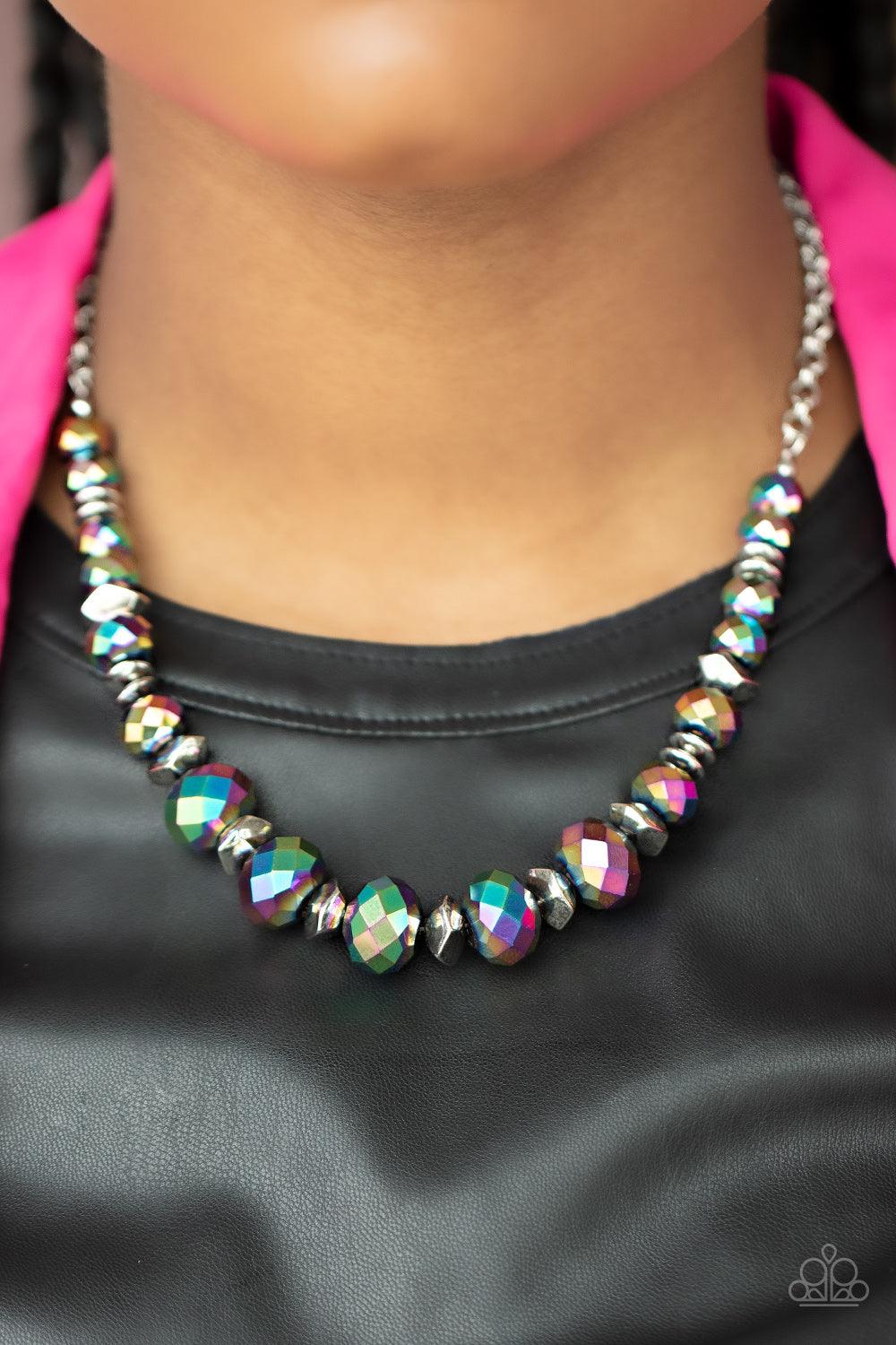 Paparazzi Accessories Cosmic Cadence - Multi Separated by silver discs and faceted silver accents, faceted oil spill crystal-like gems are threaded along an invisible wire below the collar for a stellar statement. Due to its prismatic palette, color may v