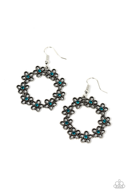 Paparazzi Accessories Floral Halos - Blue Dotted with dainty blue rhinestone centers, studded silver flowers delicately connect into a whimsical floral wreath for a seasonal fashion. Earring attaches to a standard fishhook fitting. Sold as one pair of ear