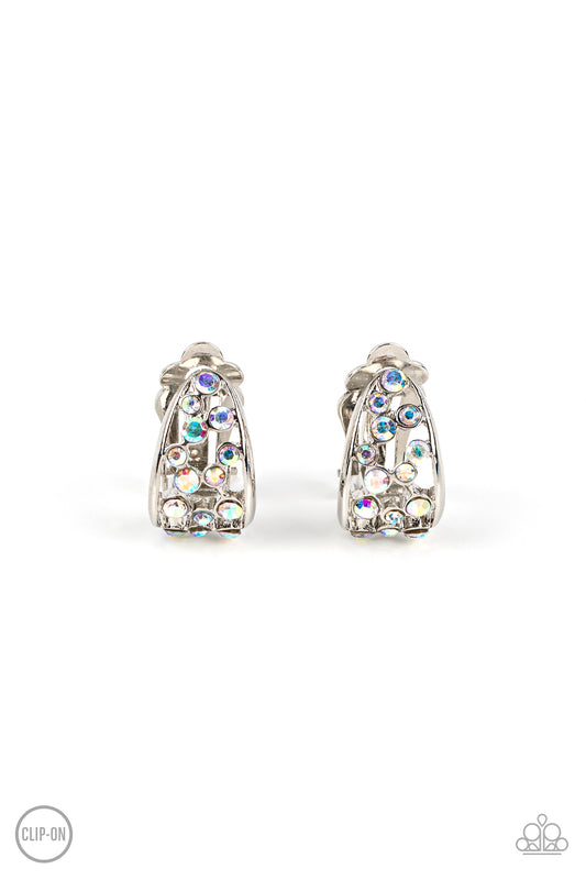 Paparazzi Accessories Extra Effervescent - Multi *Clip-On A collection of dainty iridescent rhinestones tumbles down the airy center of a curved silver frame, resulting in a stellar effervescence. Earring attaches to a standard clip-on fitting. Sold as on