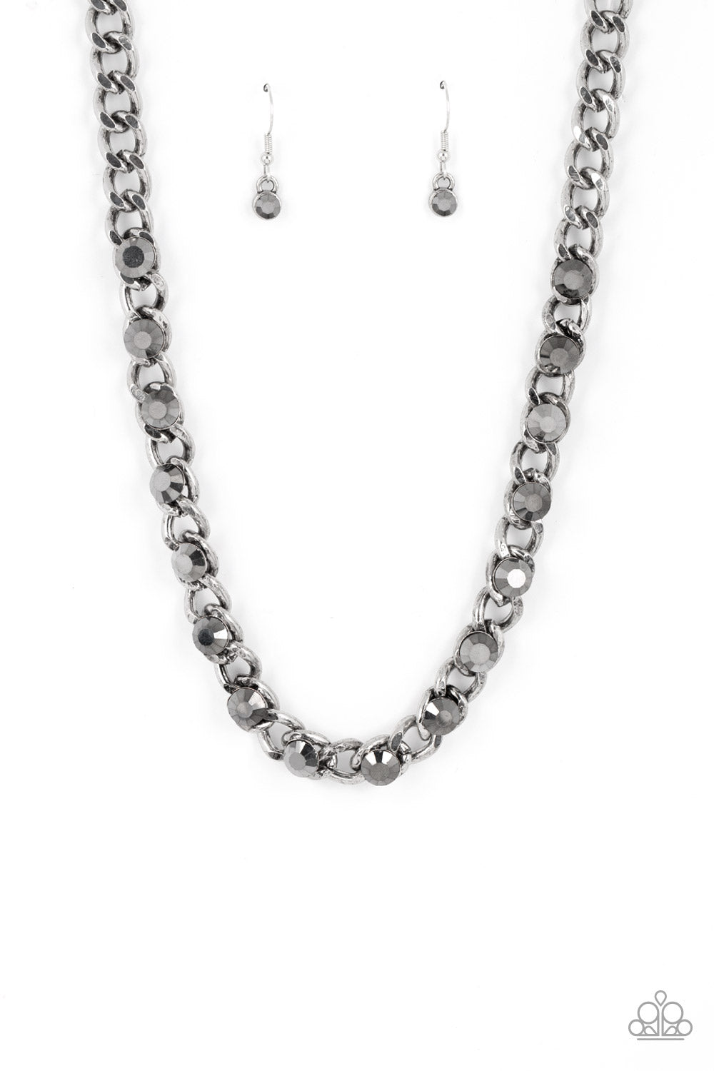 Paparazzi Accessories Major Moxie - Silver Oversized hematite rhinestones dot a row of oversized silver chain, resulting in a gritty glitz below the collar. Features an adjustable clasp closure. Sold as one individual necklace. Includes one pair of matchi