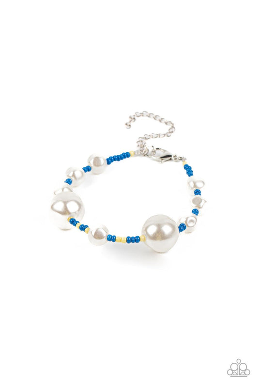 Paparazzi Accessories Contemporary Coastline - Blue Irregular-shaped pearls in varying sizes are scattered amongst blue and yellow seed beads that are threaded along a wire, resulting in a refreshing and playful style around the wrist. Features an adjusta