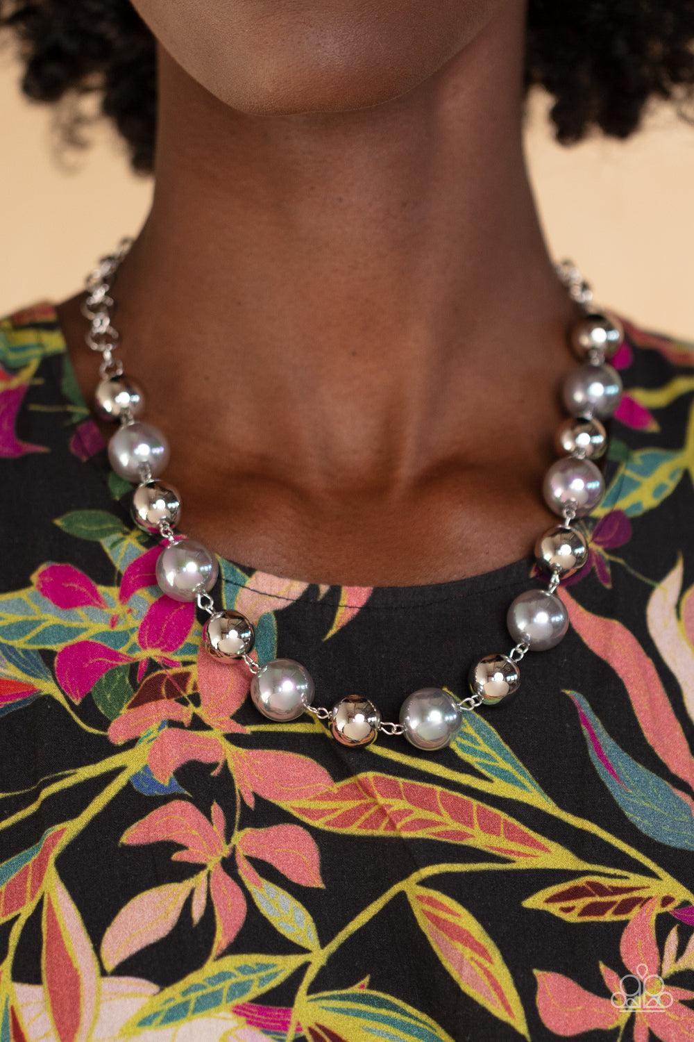 Paparazzi Accessories Dreamscape Escape - Silver Dipped in an iridescent finish, oversized silver pearls alternate with shiny silver beads below the collar for a dreamy pop of shimmer. Features an adjustable clasp closure. Sold as one individual necklace.