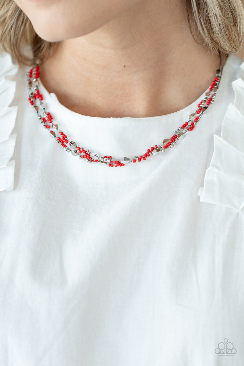 Paparazzi Accessories Explore Every Angle - Red A dainty collection of faceted silver beads, red seed beads, and silver cubes are threaded along multiple strands of silver wire below the collar, creating clustered layers. Features an adjustable clasp clos