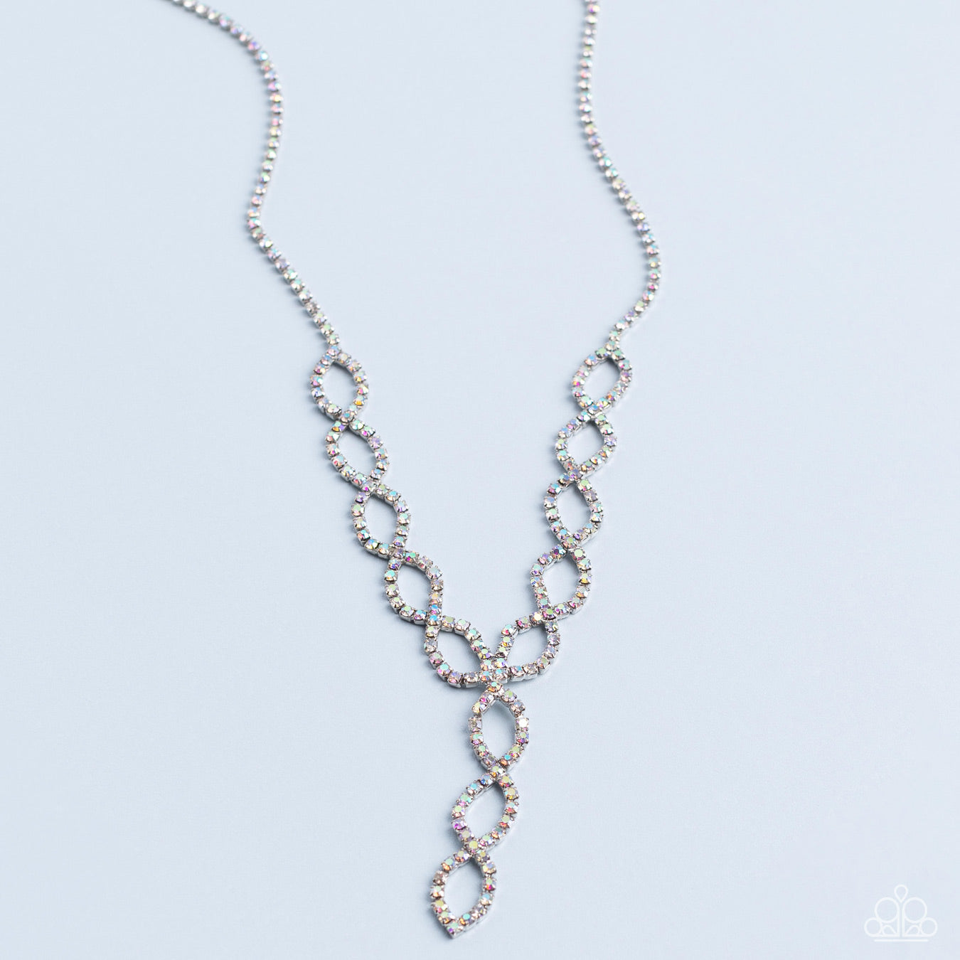 Paparazzi Accessories Infinitely Icy - Multi Strands of iridescent rhinestones delicately loop into interlocking infinities below the collar, drizzling into an icy extended pendant for a statement-making finish. Features an adjustable clasp closure. Sold