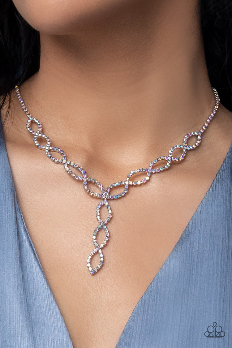 Paparazzi Accessories Infinitely Icy - Multi Strands of iridescent rhinestones delicately loop into interlocking infinities below the collar, drizzling into an icy extended pendant for a statement-making finish. Features an adjustable clasp closure. Sold