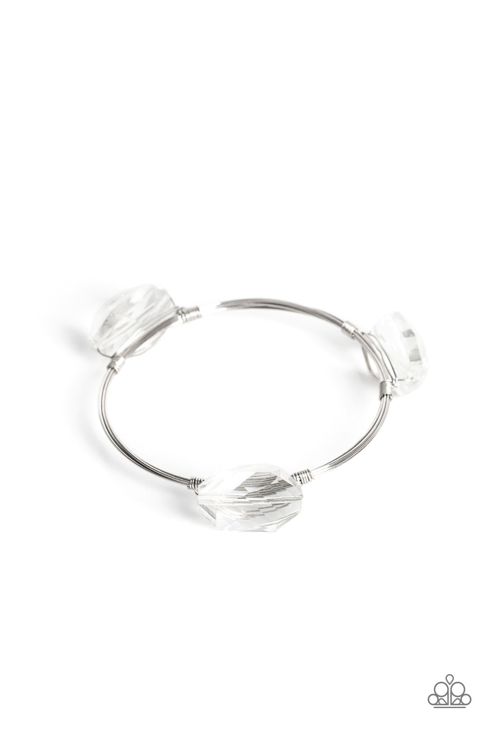 Paparazzi Accessories Galactic Getaway - White Featuring a glassy shimmer, oversized faceted gems are wrapped in place along the front of coiled silver wires that join into a solitaire bangle around the wrist for an out-of-this-world finish. Due to its pr