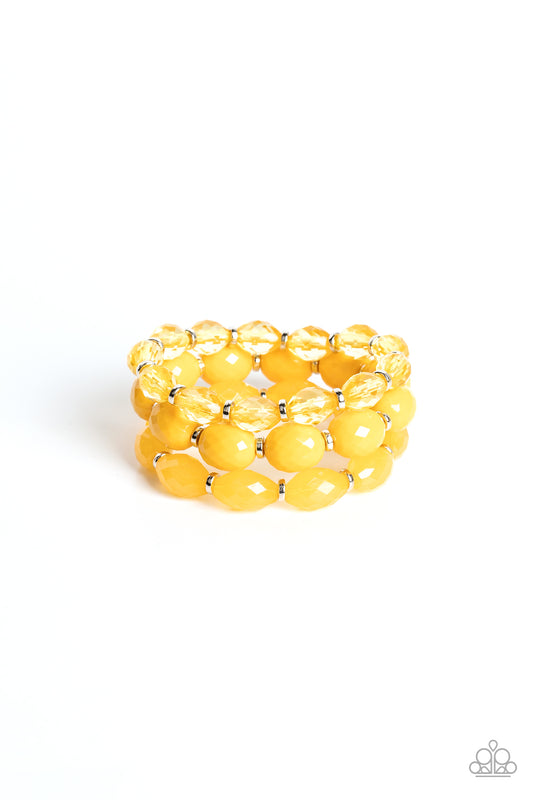 Paparazzi Accessories High Tide Hammock - Yellow Separated by dainty silver rings, mismatched rows of glassy, opaque, and solid Daffodil acrylic crystal-like beads are threaded along stretchy bands around the wrist, creating vivacious layers. Sold as one