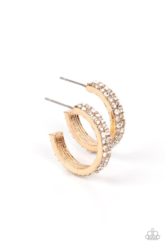 Paparazzi Accessories Positively Petite - Gold Sparkling white rhinestones line the front of a petite gold hoop, creating edge-to-edge shimmer. Earring attaches to a standard post fitting. Hoop measures approximately 3/4" in diameter. Sold as one pair of