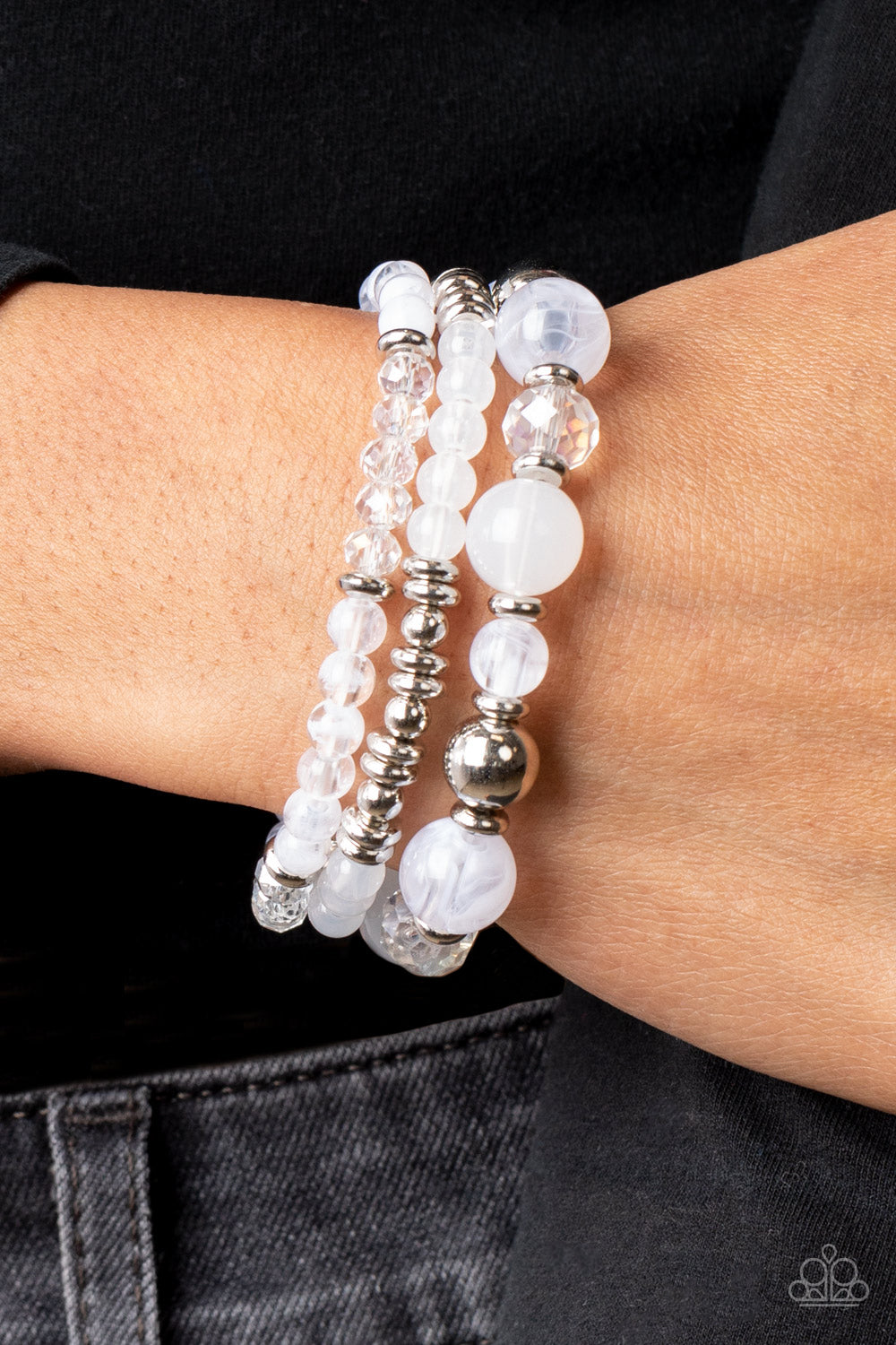 Paparazzi Accessories Shoreside Stroll - White A mismatched assortment of glassy and opaque white beads joins white crystal-like and dainty silver accents along stretchy bands around the wrist, resulting in dreamy layers. Sold as one set of three bracelet