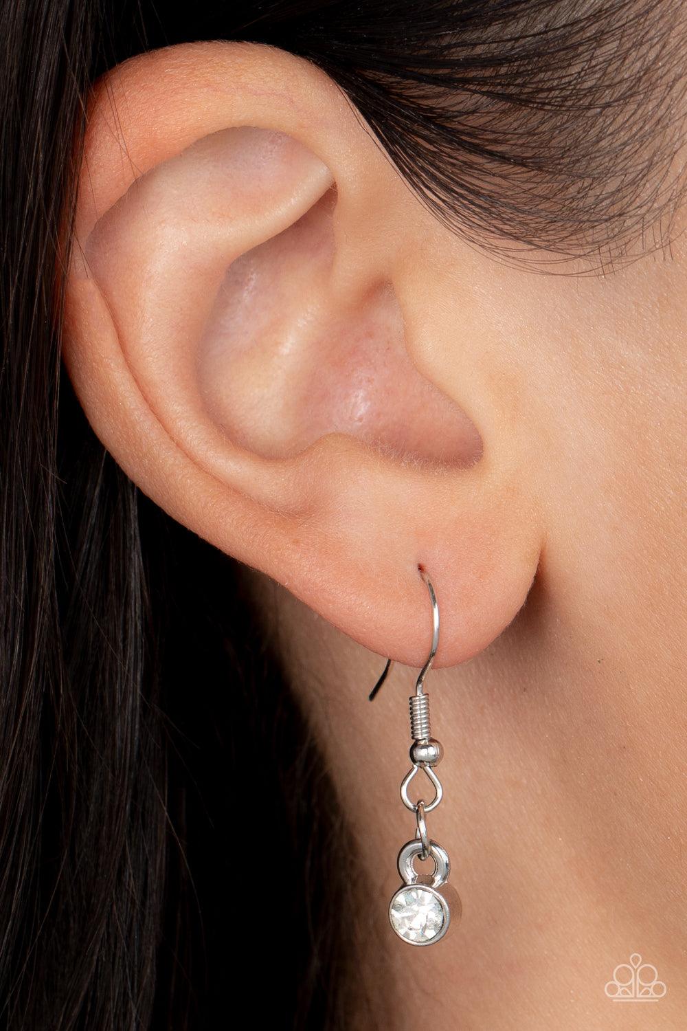 Paparazzi Accessories Warp Speed - Blue Warped silver frames asymmetrically curl around dainty white rhinestones and blue and iridescent gem accents, interlocking into a contemporary statement piece below the collar. Features an adjustable clasp closure.