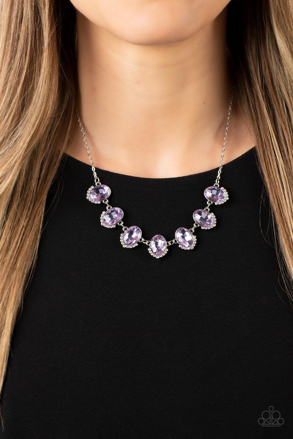 Paparazzi Accessories Unleash Your Sparkle - Purple Dainty rows of glittery white rhinestones gently curve around the bottoms of oversized Very Peri oval gems. The sparkly frames delicately connect below the collar, creating a colorful centerpiece. Featur