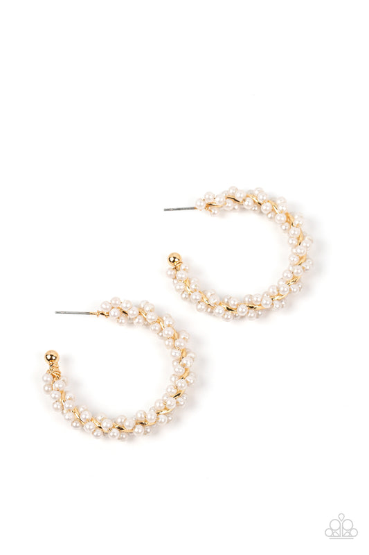 Paparazzi Accessories Yacht Royale - Gold A dainty strand of white pearls is delicately wrapped around a classic gold hoop, creating bubbly refinement. Earring attaches to a standard post fitting. Hoop measures approximately 1 1/2" in diameter. Sold as on